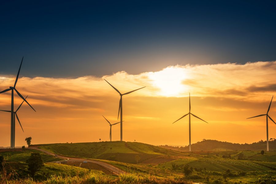 Wind Turbines At sunset, wind turbine renewable. Green energy concept